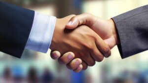 Ñonfident handshake between individuals with confidence in the success of profitable business deals. The concept of successful negotiations. Businessman shake hand with partner.