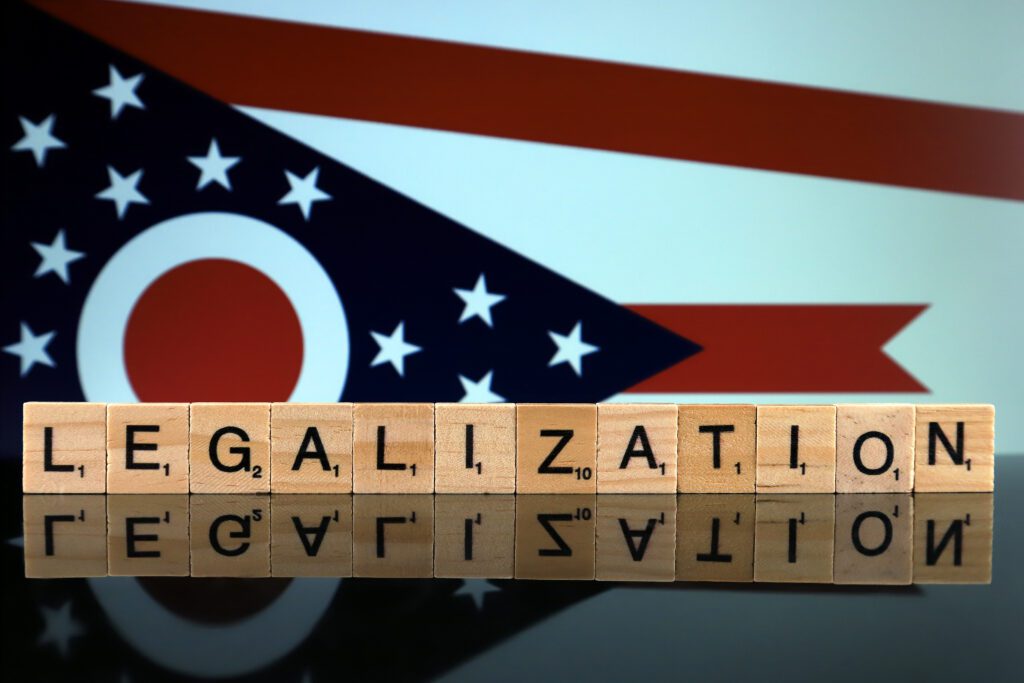 hio State Flag and word LEGALIZATION made of small wooden letters. 